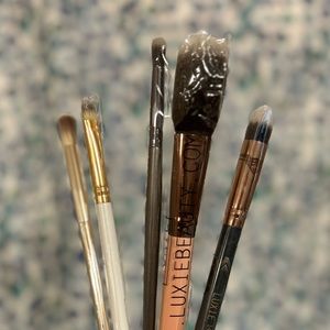 Sample makeup brushes, various sizes and brands.